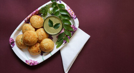 Appum or Appe, Appam or Mixed dal or Rava Appe served with green   chutney. A Ball shape popular south Indian breakfast dish, Selective focus
