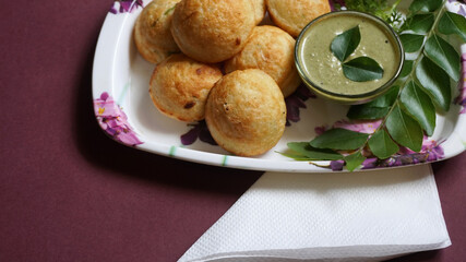 Appum or Appe, Appam or Mixed dal or Rava Appe served with green   chutney. A Ball shape popular south Indian breakfast dish, Selective focus
