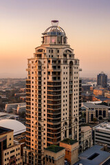 A vertical sot of the Michelangelo towers in Sandton, Johannesburg taken on a clear day during a golden sunset using a vertical composition. 