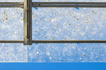 A horizontal abstract close-up of a blue tug boat, covered in bird droppings, Cape Town, South Africa