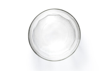 Top view of empty glass jar isolated on white background.