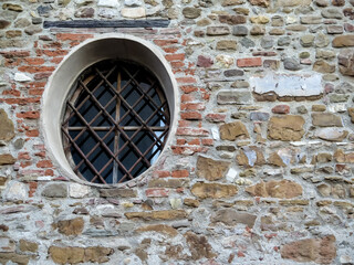 Old brick wall with oval window