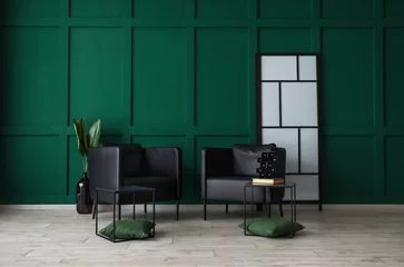 Fototapeten Interior of modern living room with black armchairs and green wall © Pixel-Shot