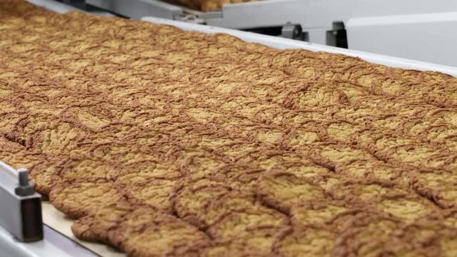 conveyor of sweet cookies in motion medium plan