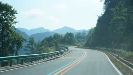 One countryside road across the mountains in the countryside of the China in spring