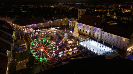 Colored Ferris Wheel at Christmas Market on a calm night