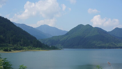 The beautiful lake landscapes surrounded by the green mountains in the countryside of the China