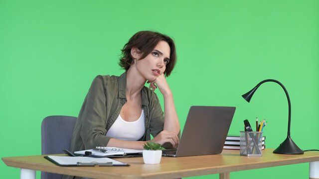 Lady it sit table use netbook dreamy holiday isolated green color background - Powered by Adobe