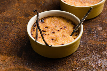 Spanish crema catalana. Creme brulee. Traditional French vanilla cream dessert. Burned cream, burnt or Trinity creme. Rich custard base topped with layer of hardened caramelized sugar.