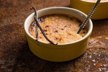 Spanish crema catalana. Creme brulee. Traditional French vanilla cream dessert. Burned cream, burnt or Trinity creme. Rich custard base topped with layer of hardened caramelized sugar.