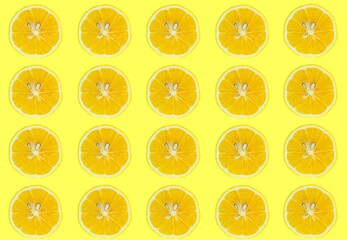 Lemon slices pattern, top view of lemon slices isolated on a yellow background.