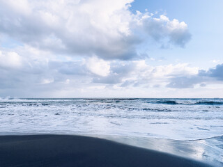 Amazing sky reflection at the sea coast, sand beach, evening time, natural background