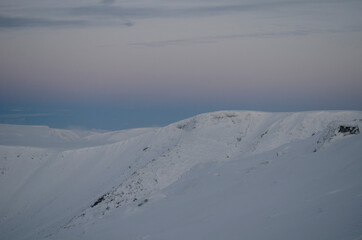 The Khibiny peaks lighted by the  sun  winter background