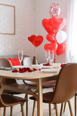 Table setting in light dining room decorated for Valentine's Day
