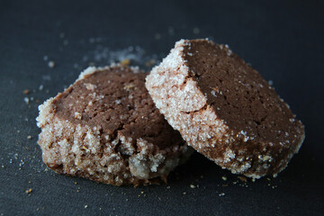 chocolate shortbread cookies on a dark background