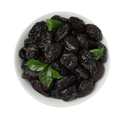 Bowl with sweet dried prunes and green leaves isolated on white, top view
