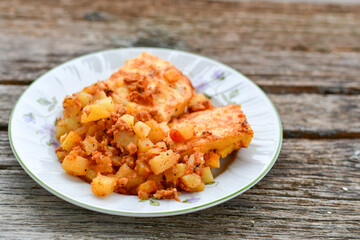  Potato and minced meat  Casserole  with   parmesan cheese and garlic on wooden rustic bakcground.  Bulgarian moussaka