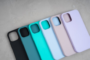 Set of colored silicone cases for smartphone. Cases set for smartphone on grey background....