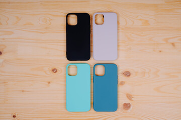 Four silicone smartphone cases. Protective smartphone cases in black, beige, mint and turquoise...