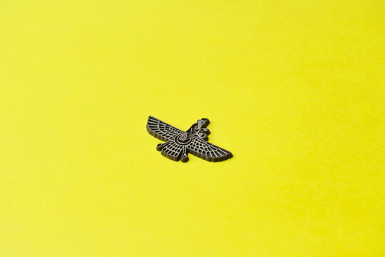 parsi holy symbol badge with yellow background