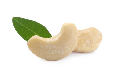 Tasty organic cashew nuts and green leaf isolated on white