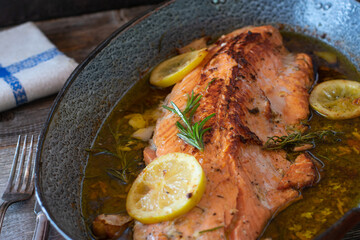 Roasted salmon with olive oil, garlic, lemon sauce
