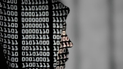 Binary language projected onto the profile of a hooded hacker