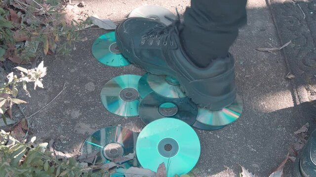 stomping on old CDs
