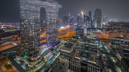 Fototapeta na wymiar Futuristic Dubai Downtown and finansial district skyline aerial night timelapse.