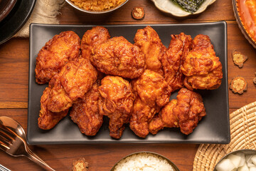Traditional Korean food, Korean Fried chicken with spicy sauce  with rice, seaweed and Kimchi...