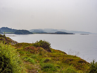 Landscape view of the coastline and hills line, from the Ganavan beach walk, Ganavan, Oban, Scotland, UK