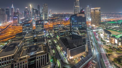 Fototapeta na wymiar Futuristic Dubai Downtown and finansial district skyline aerial night timelapse.