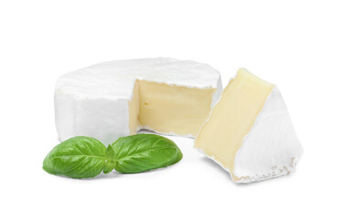 Tasty cut brie cheese with basil on white background - obrazy, fototapety, plakaty
