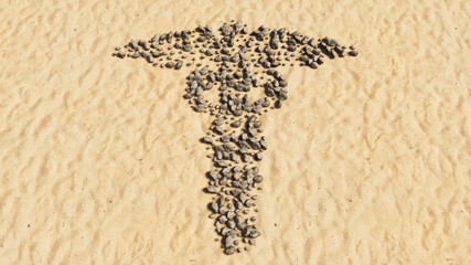 Concept conceptual stones on beach sand handmade symbol shape, golden sandy background, caduceus medical symbol. 3d illustration metaphor for emergency, ambulance, hospital pharmacy, health, medicine