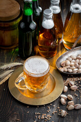 Light beer in a glass, on an old background.
