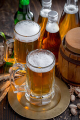Light beer in a glass, on an old background.