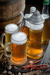 Light beer in a glass, on an old background.