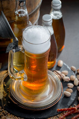 Light beer in a glass on an old background.