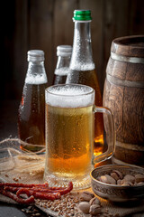 Light beer in a glass on an old background.