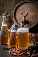 Light beer in a glass on an old background.