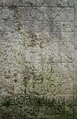 Ancient stone with medieval latin writing. Ancient church