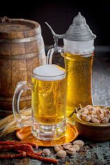 Light beer in a glass on an old background.