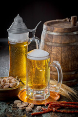 Light beer in a glass on an old background.