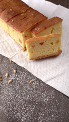 Slices of home made wholemeal bread on a white background with wheat and flour.