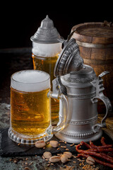 Light beer in a glass on an old background.