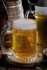 Light beer in a glass on an old background.