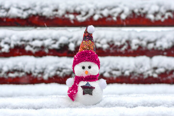 Merry christmas and happy new year greeting card with copy space Happy little snowman in red cap...