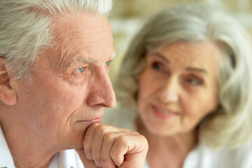 Portrait of sad senior couple