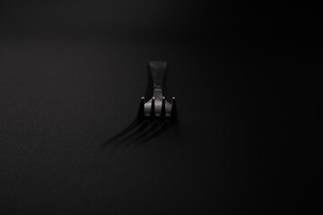 Fototapeta na wymiar Plugs with metal, silver, lie on a black background