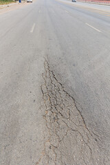 Surface of asphalt driveway with crack